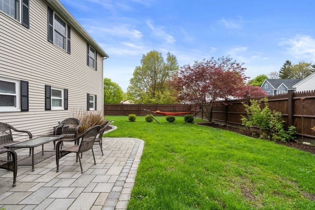 14 Rutledge Road Natick, MA 01760 - Photo 31 of 39 a view of a house with backyard and sitting area