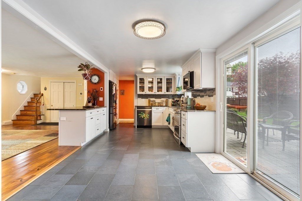14 Rutledge Road Natick, MA 01760 - Photo 7 of 39 a view of a kitchen with fridge and a workspace