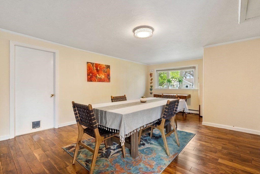 14 Rutledge Road Natick, MA 01760 - Photo 10 of 39 a view of a dining room with furniture and wooden floor