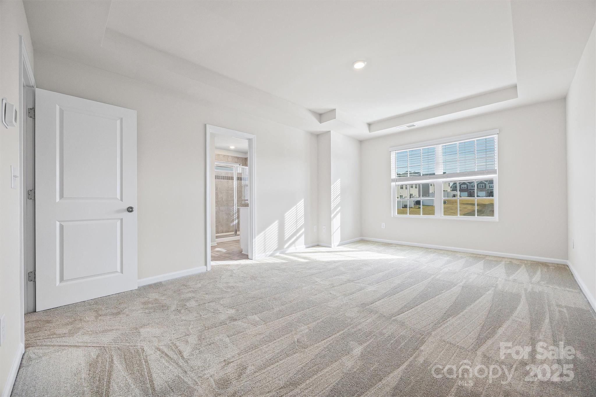 5038 Moss Pne Way Fort Mill, SC 29708 - Photo 14 of 25 a view of an empty room with a window and a kitchen
