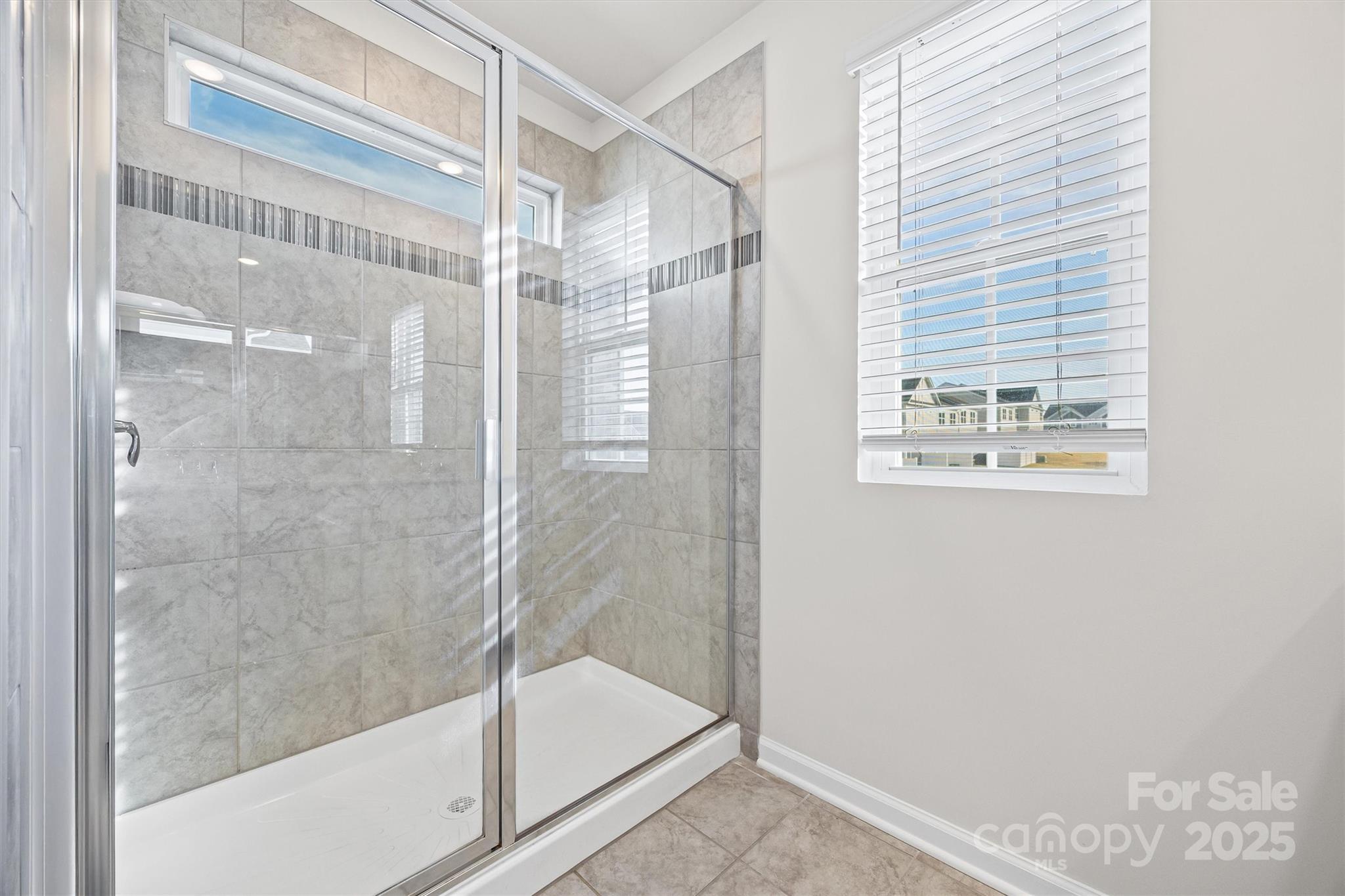 5038 Moss Pne Way Fort Mill, SC 29708 - Photo 16 of 25 a bathroom with a glass shower door