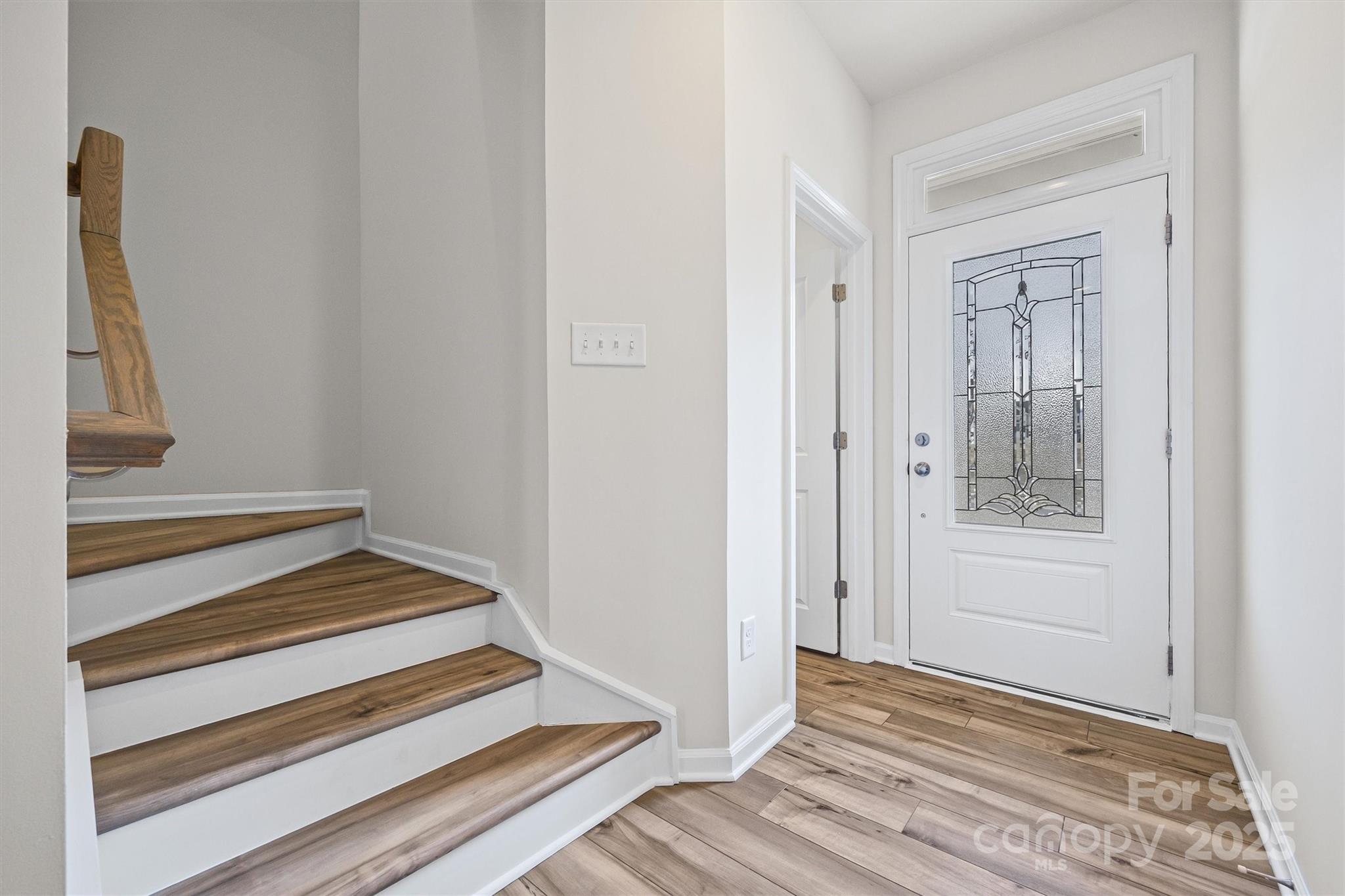 5038 Moss Pne Way Fort Mill, SC 29708 - Photo 3 of 25 a view of a hallway with wooden floor and entryway