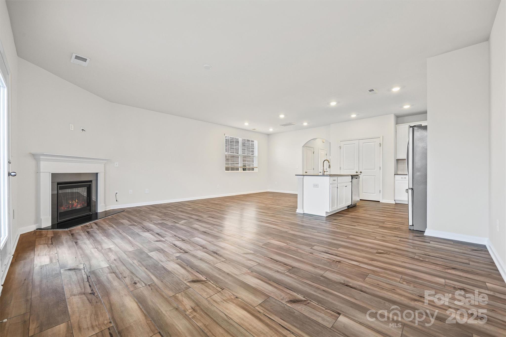 5038 Moss Pne Way Fort Mill, SC 29708 - Photo 6 of 25 a view of kitchen and hall with wooden floor