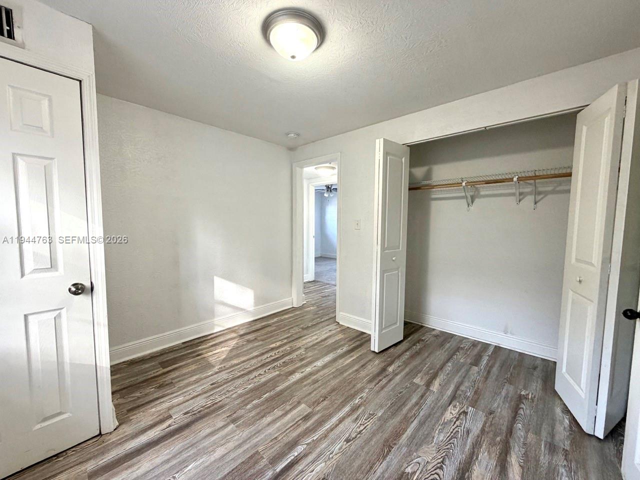 565 Forrest Drive Bartow, FL 33830 - Photo 12 of 44 wooden floor in an empty room
