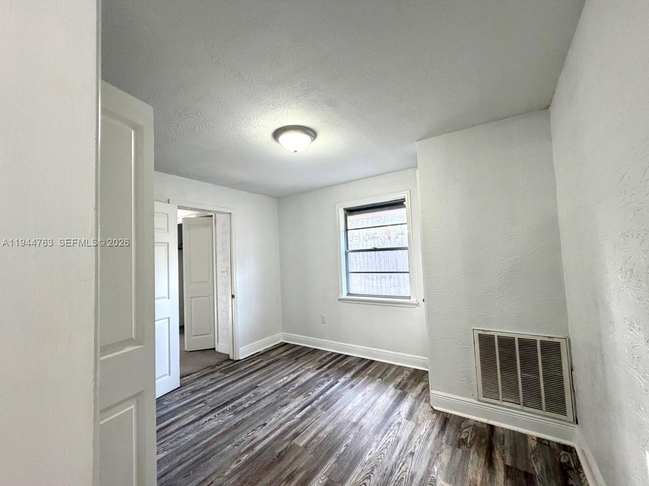 565 Forrest Drive Bartow, FL 33830 - Photo 13 of 44 a view of wooden floor and windows in a room