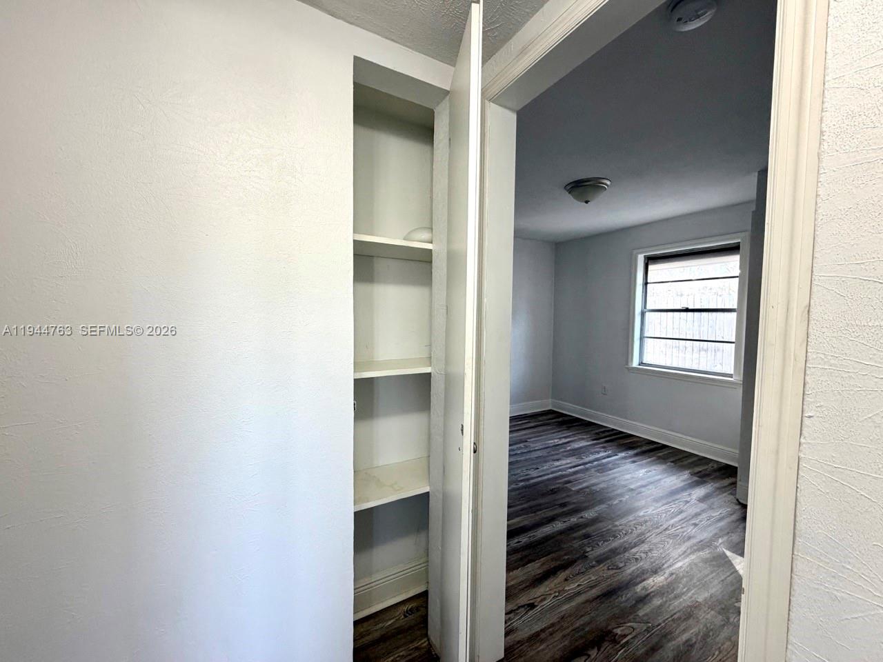 565 Forrest Drive Bartow, FL 33830 - Photo 15 of 44 a view of an empty room with wooden floor and a window