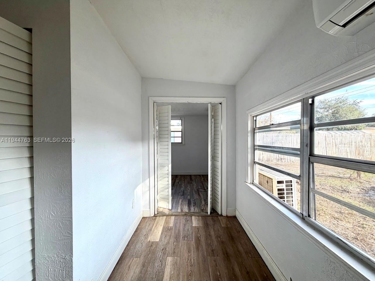 565 Forrest Drive Bartow, FL 33830 - Photo 29 of 44 a view of a room with wooden floor and a window