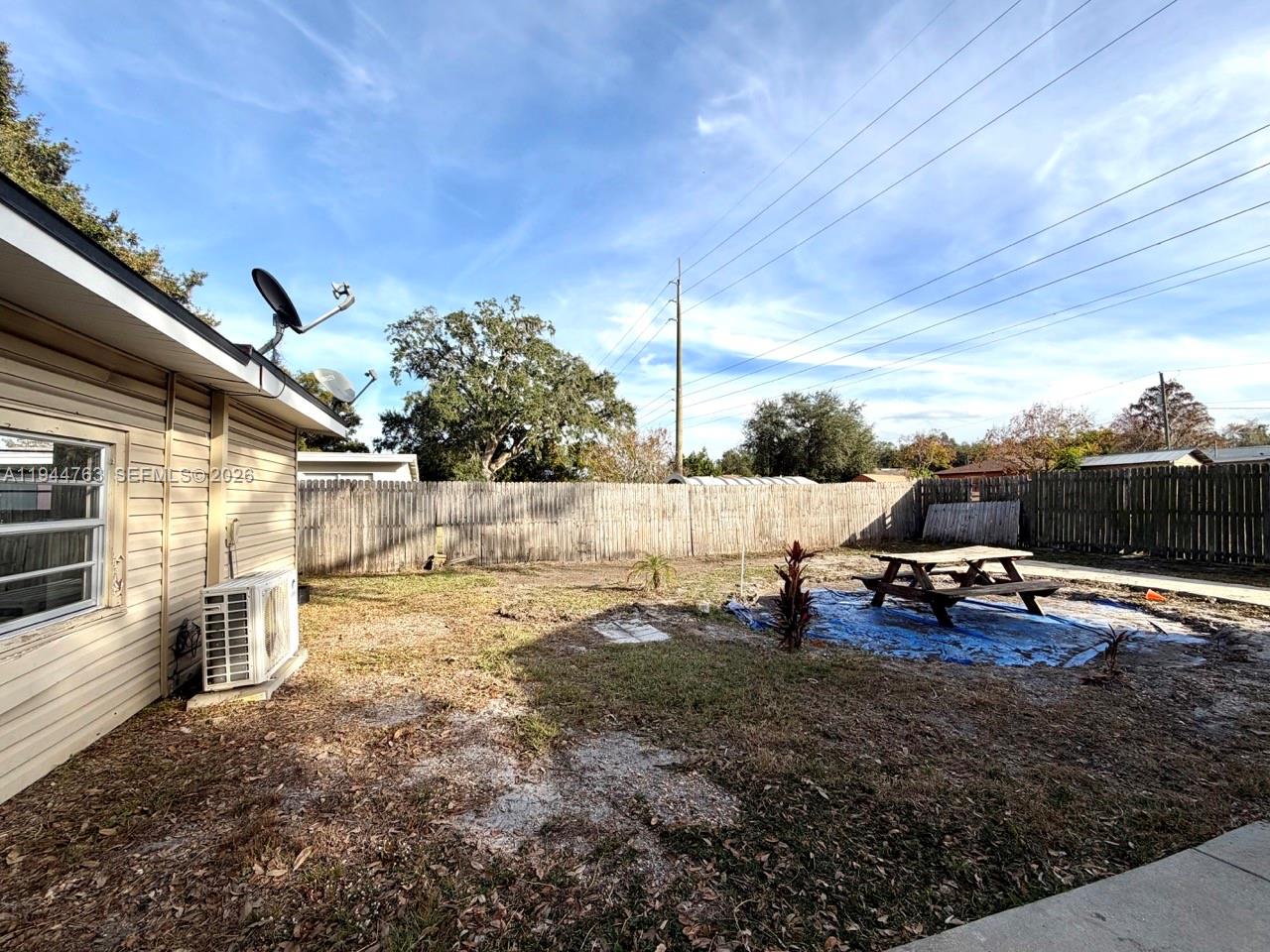 565 Forrest Drive Bartow, FL 33830 - Photo 38 of 44 a view of a backyard with lawn chairs and couches