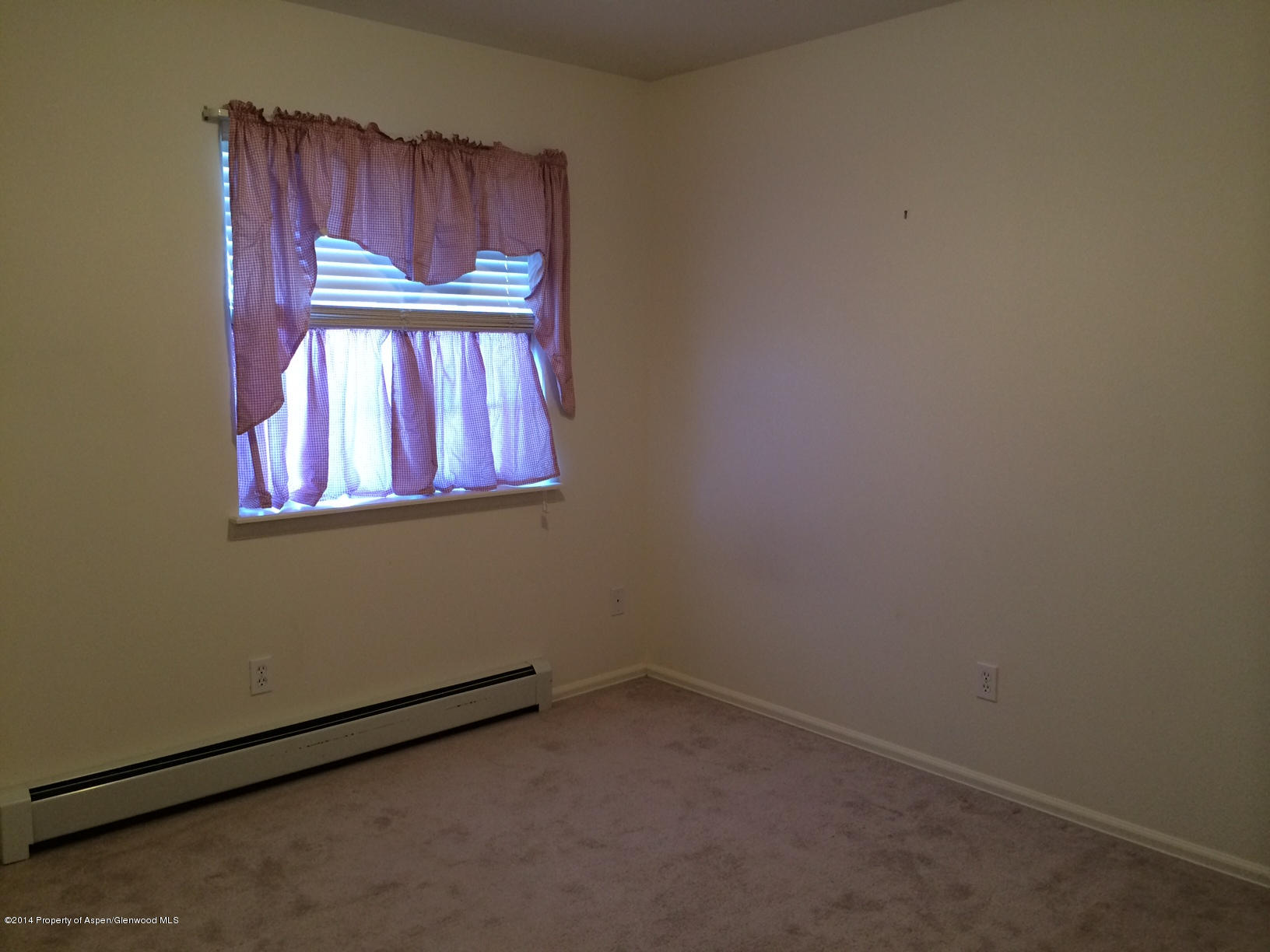 459 Columbine Drive Rifle, CO 81650 - Photo 12 of 20 a view of an empty room and window
