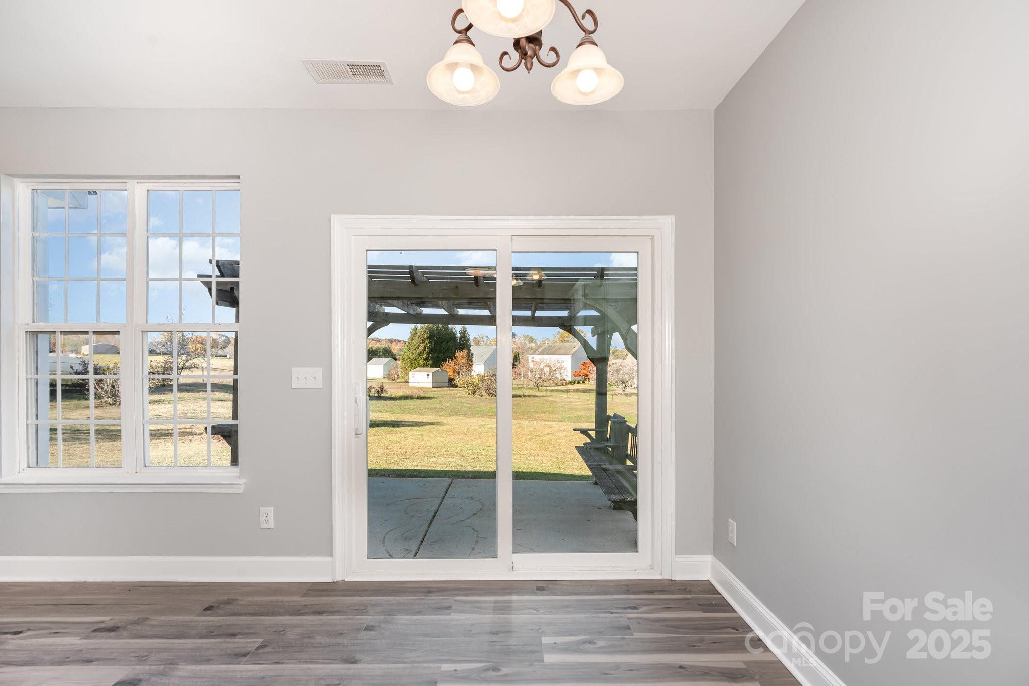 1457 Jc Raulston Court Hickory, NC 28602 - Photo 11 of 39 a view of livingroom with furniture wooden floor and window