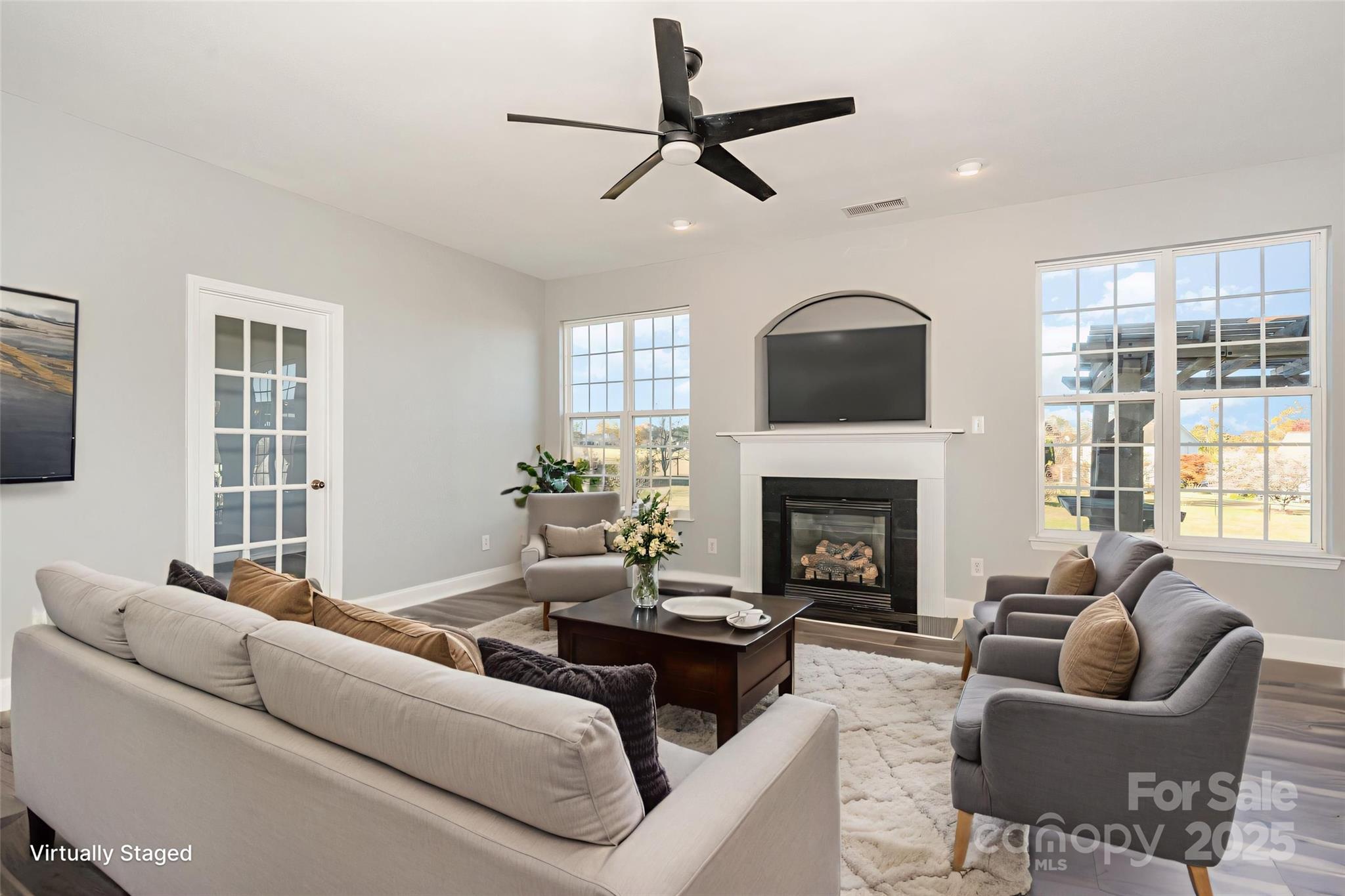 1457 Jc Raulston Court Hickory, NC 28602 - Photo 13 of 39 a living room with furniture a fireplace and windows
