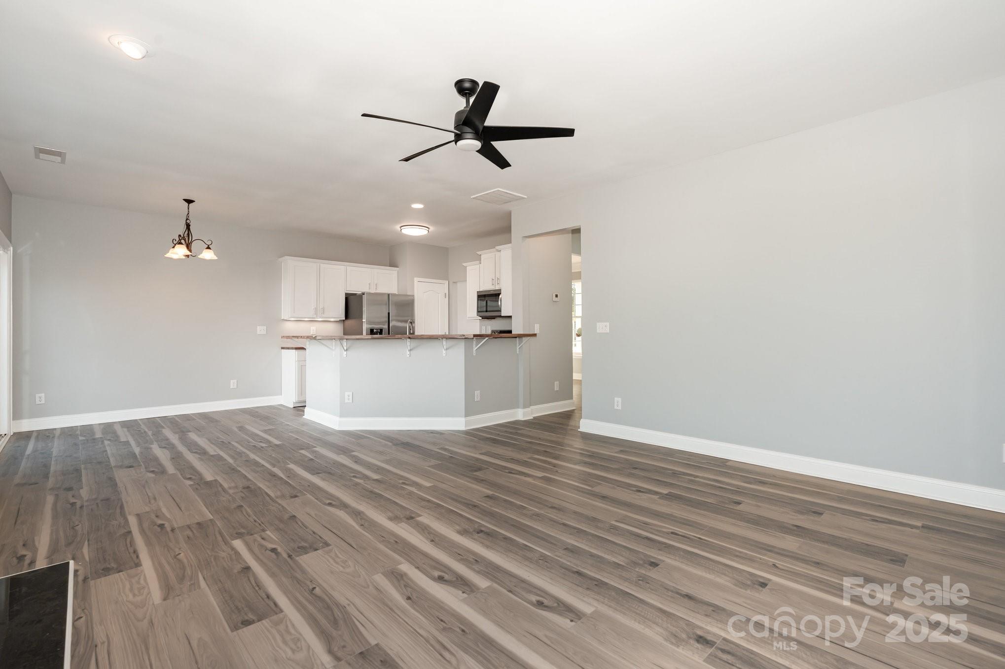 1457 Jc Raulston Court Hickory, NC 28602 - Photo 15 of 39 a view of a kitchen with a dishwasher cabinets and wooden floor