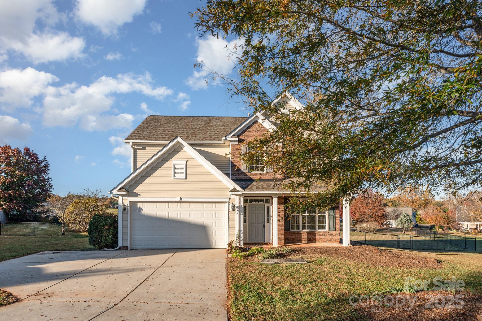 1457 Jc Raulston Court Hickory, NC 28602 - Photo 2 of 39 a front view of a house with a yard and garage
