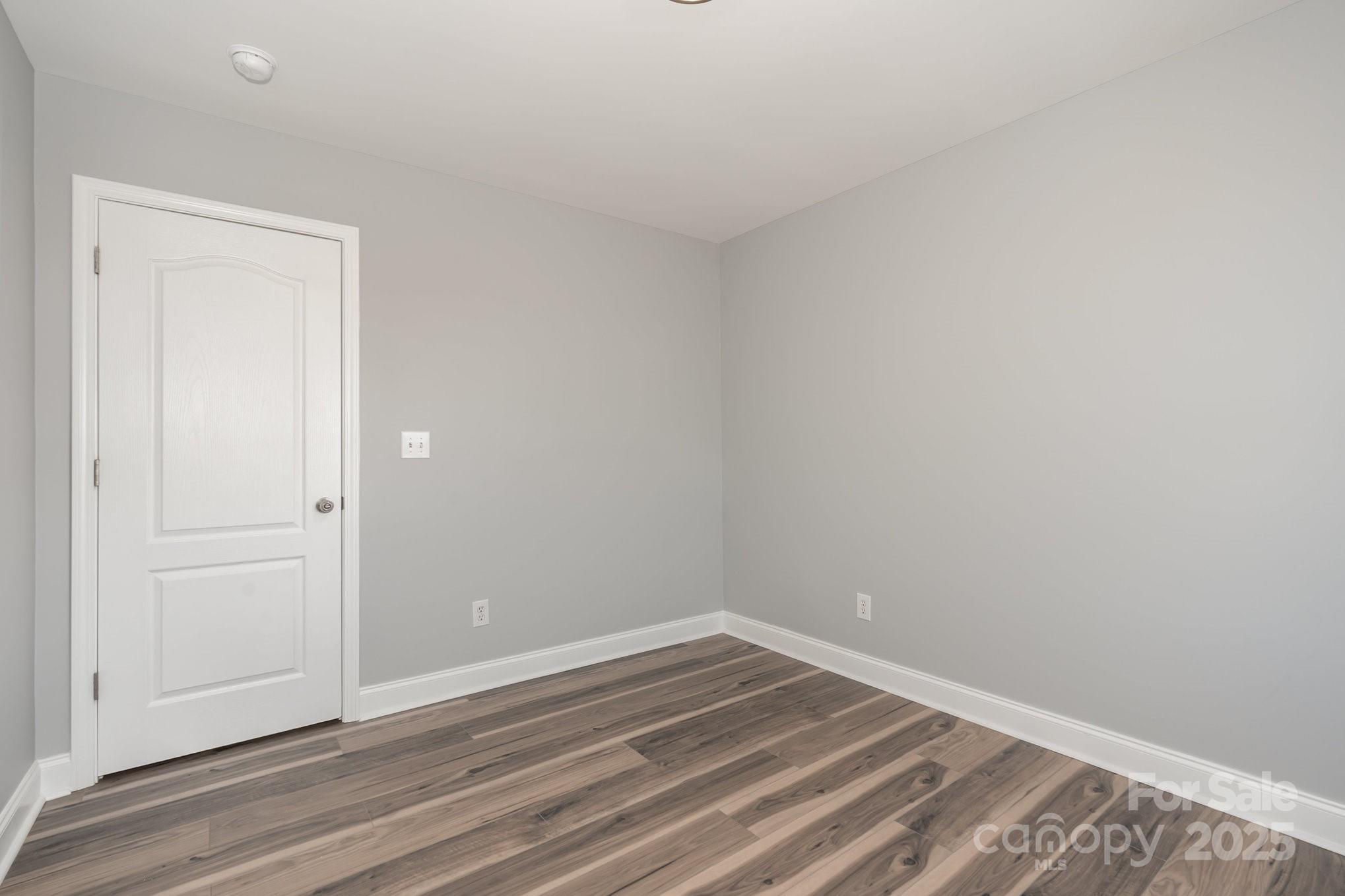 1457 Jc Raulston Court Hickory, NC 28602 - Photo 26 of 39 an empty room with wooden floor and closet