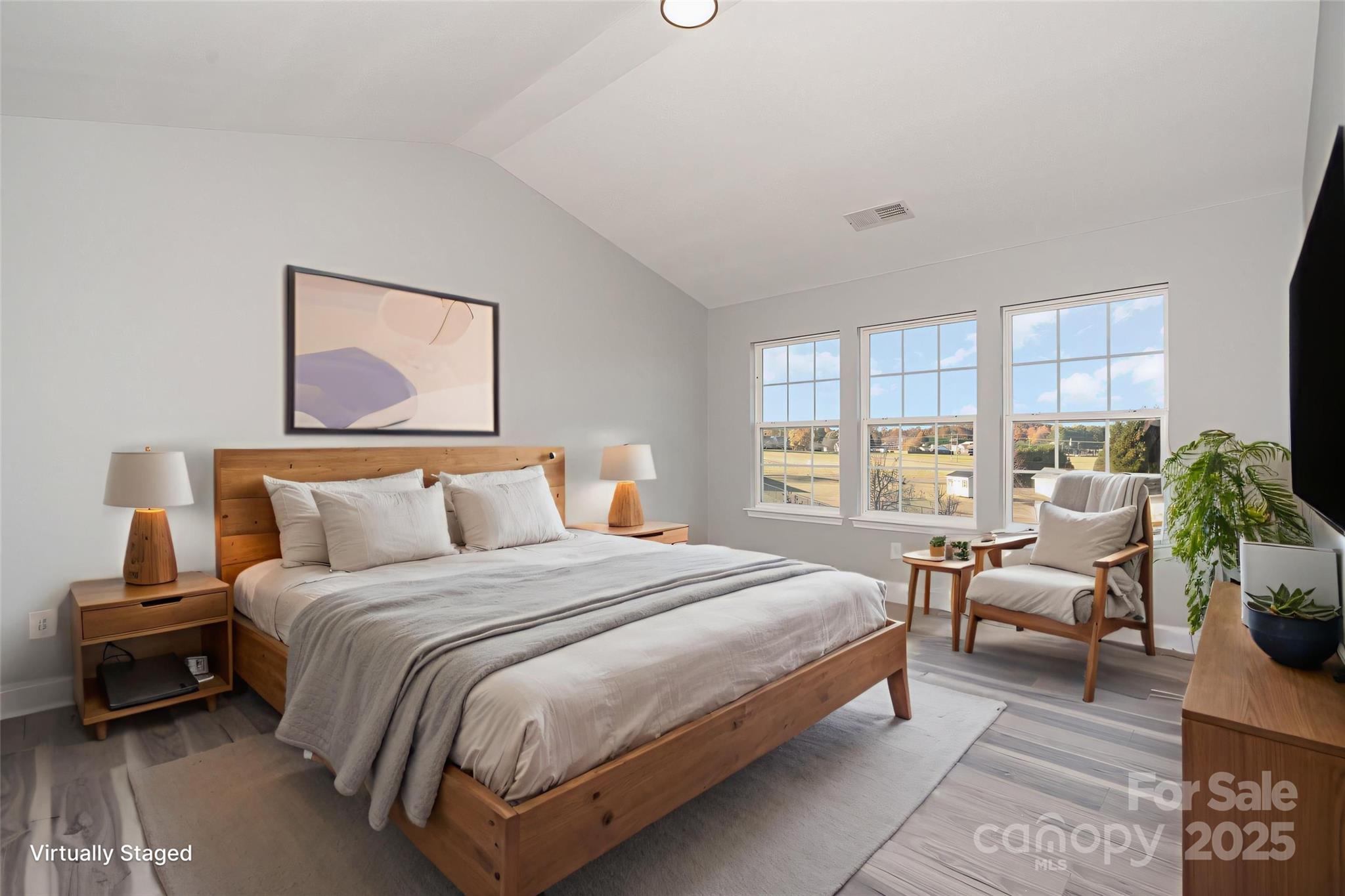 1457 Jc Raulston Court Hickory, NC 28602 - Photo 28 of 39 a bedroom with a bed and large windows