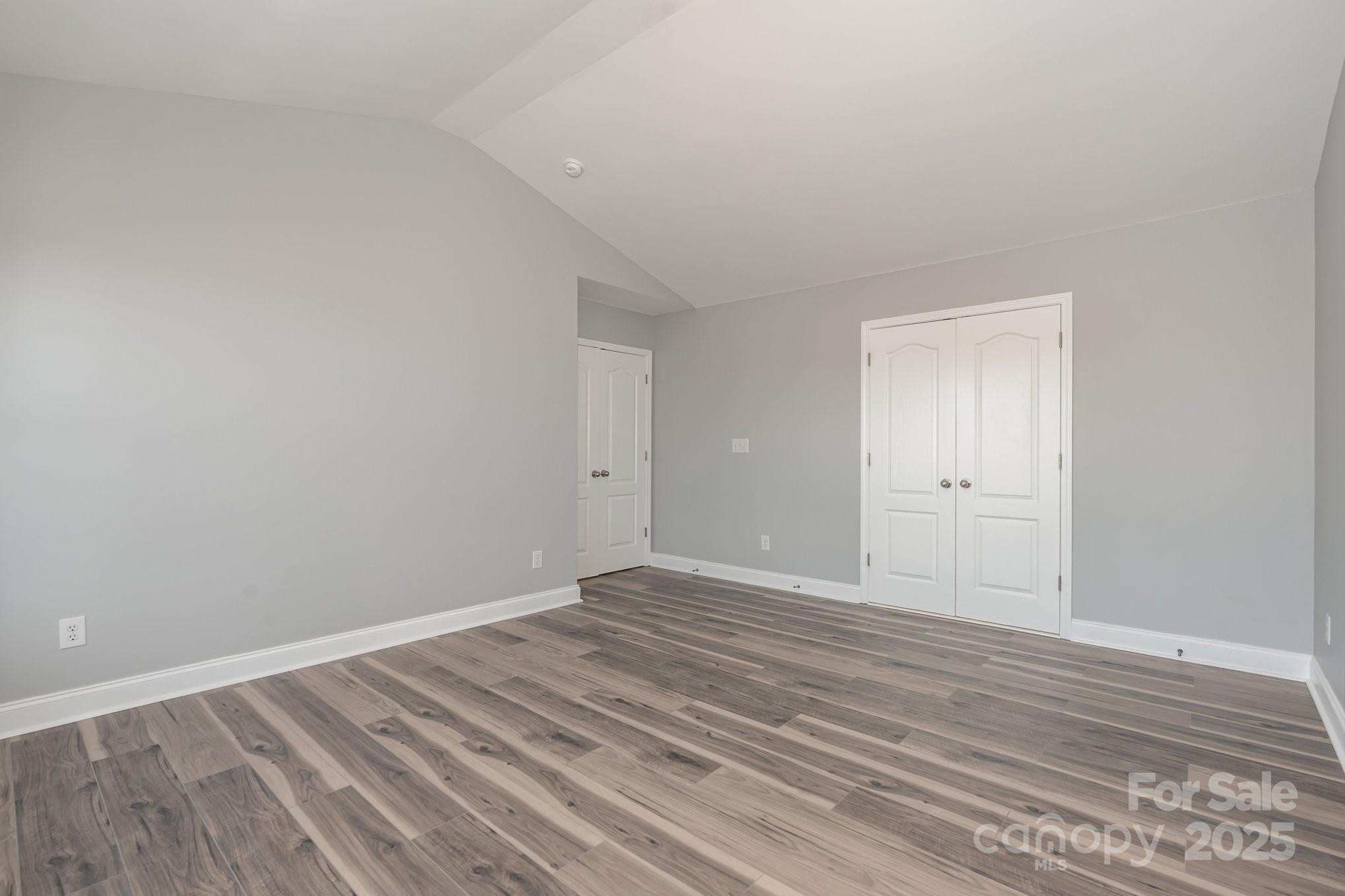 1457 Jc Raulston Court Hickory, NC 28602 - Photo 29 of 39 a view of an empty room and wooden floor