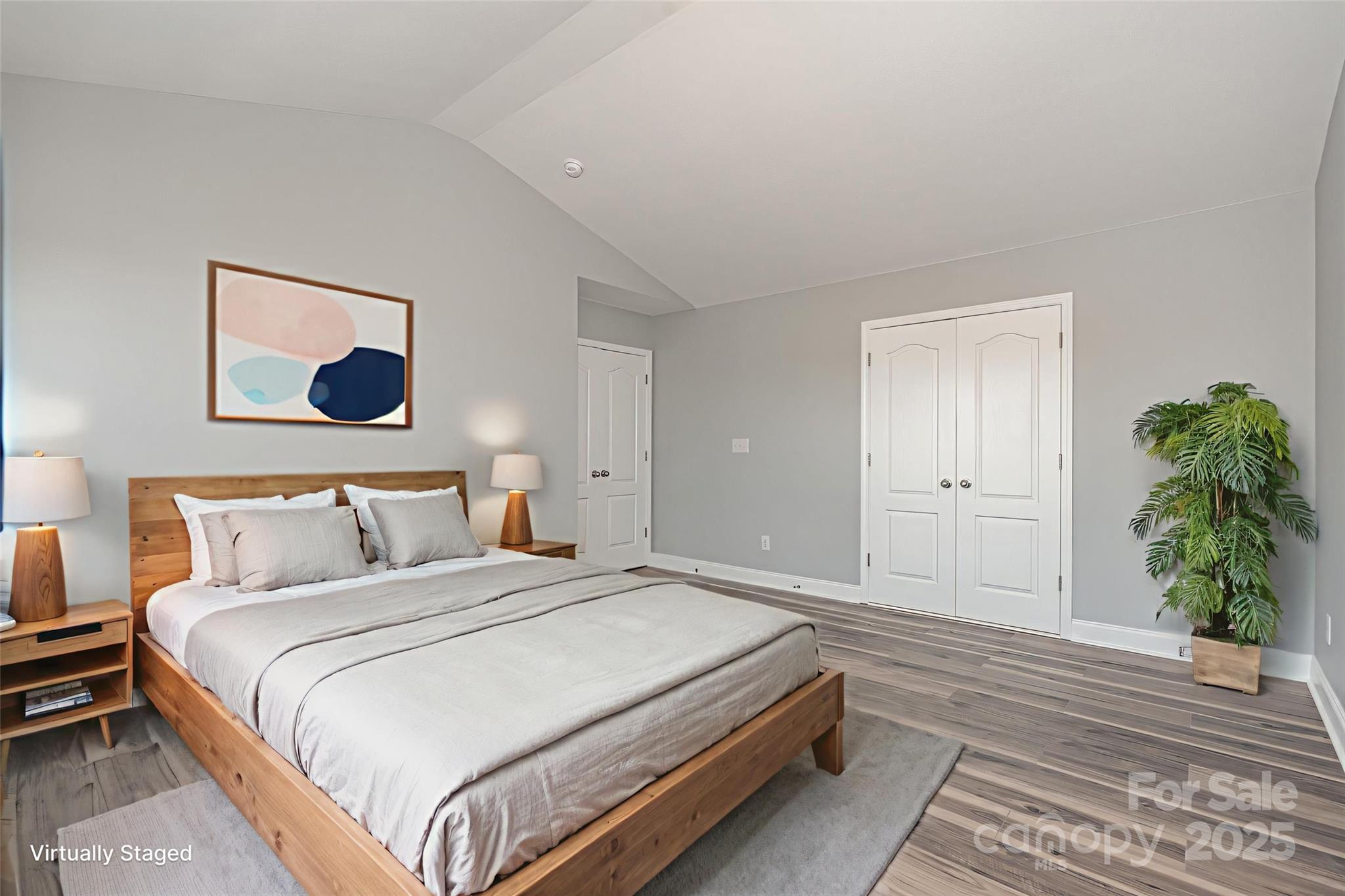 1457 Jc Raulston Court Hickory, NC 28602 - Photo 30 of 39 a bedroom with a bed and a potted plant