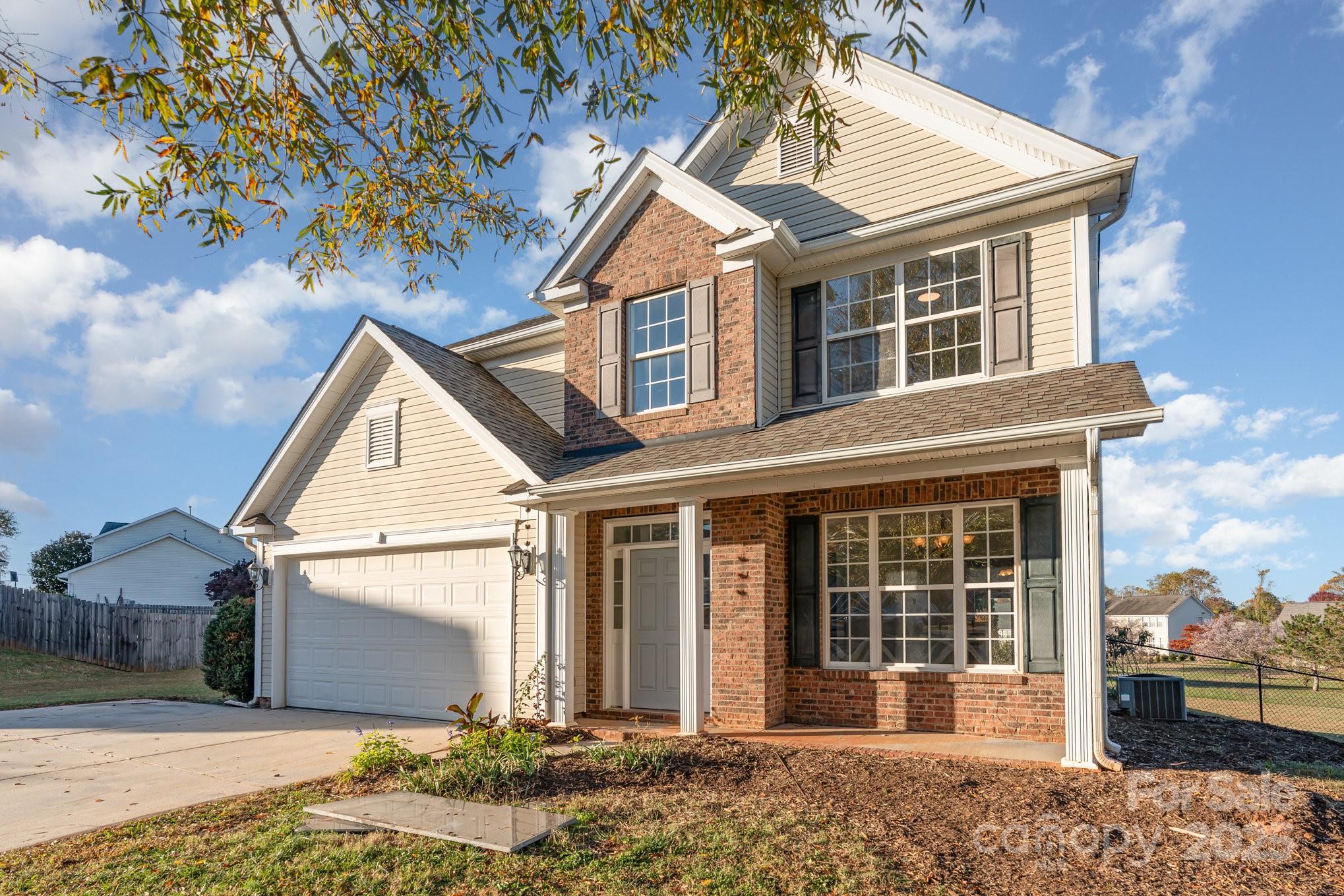 1457 Jc Raulston Court Hickory, NC 28602 - Photo 3 of 39 a front view of a house with garden