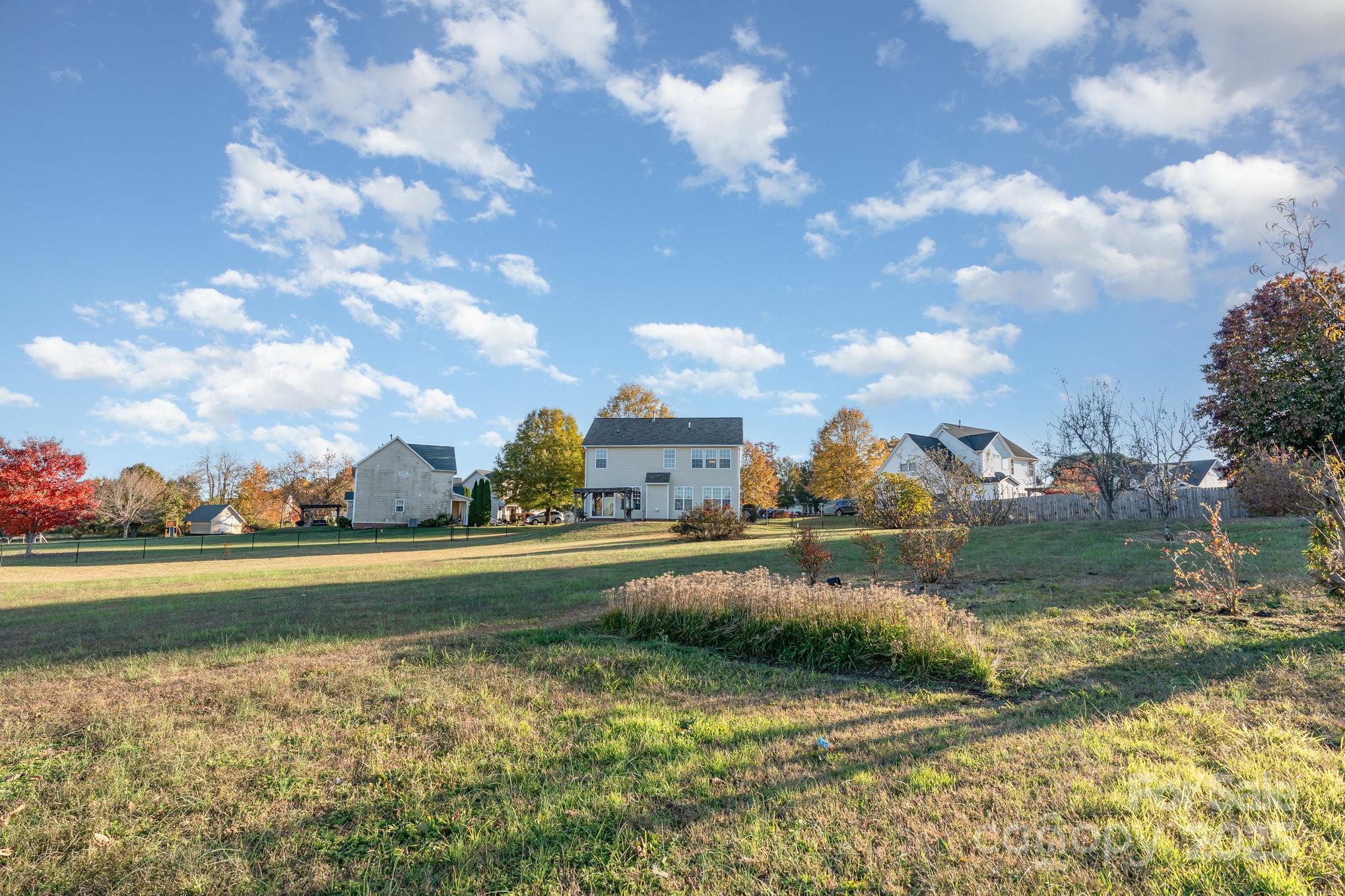 1457 Jc Raulston Court Hickory, NC 28602 - Photo 36 of 39 a view of a lake with a house in the background
