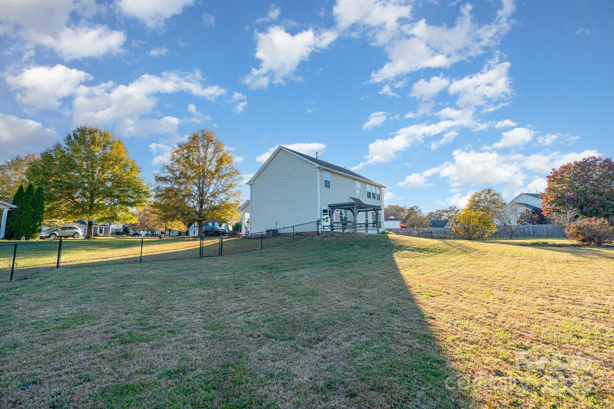 1457 Jc Raulston Court Hickory, NC 28602 - Photo 38 of 39 a view of a house with pool and a yard