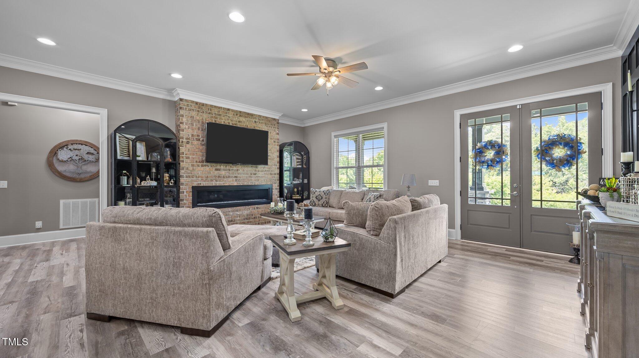 4152 Boyd Wright Road Burlington, NC 27215 - Photo 13 of 65 Brick accent wall with propane linear fireplace insert.