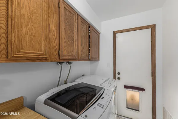 a utility room with dryer and washer