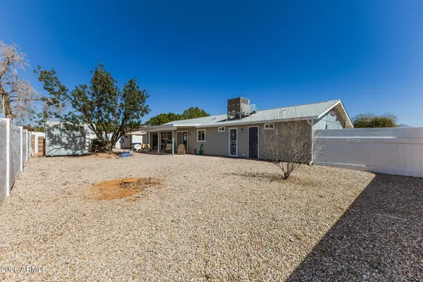 a house view with a backyard space