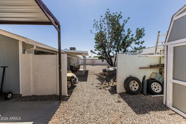 a view of a house with a car parked in it