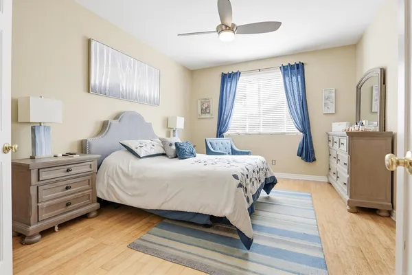 a bedroom with a bed and a dresser