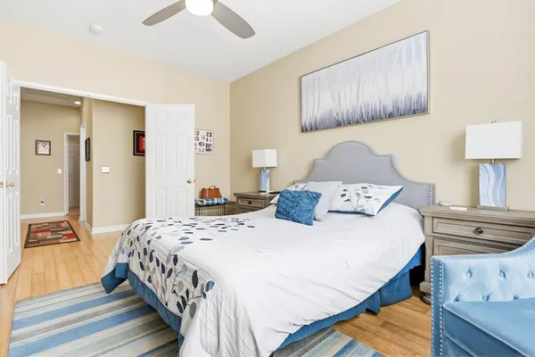 a bedroom with a bed and a lamp