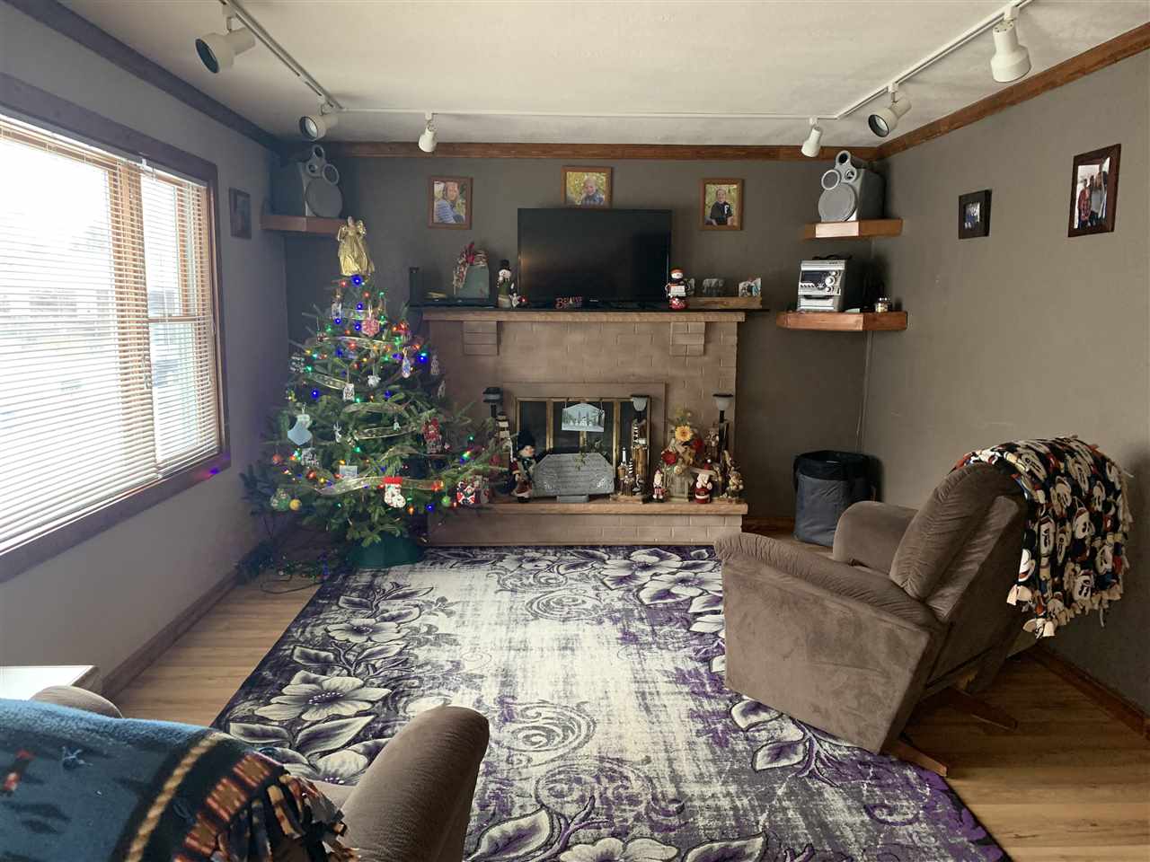 118 East Division Road Shannon, IL 61078 - Photo 3 of 16 a living room with furniture and a floor to ceiling window