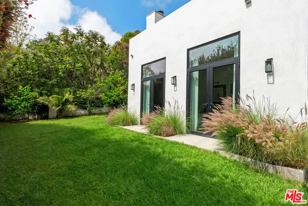 a view of a pathway with a yard