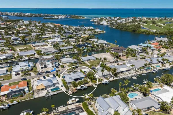 an aerial view of a house with a ocean view