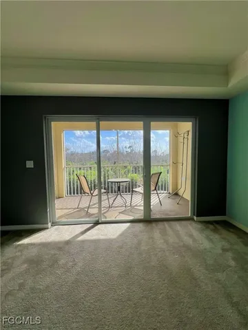 a view of an empty room with a fireplace