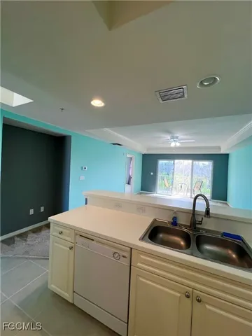 a kitchen with a sink and cabinets