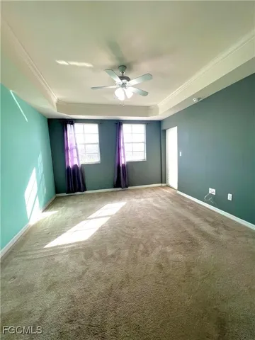 a view of wooden floor and windows in an empty room