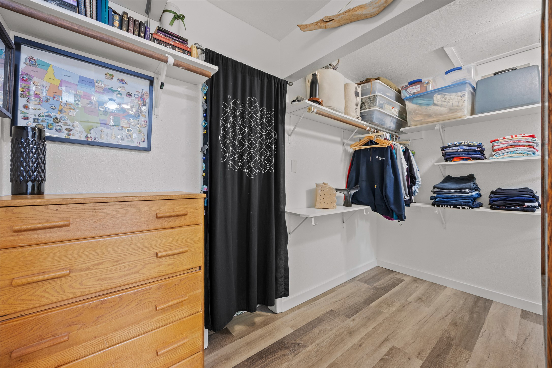 5506 South Pleasant Valley Road Austin, TX 78744 - Photo 15 of 25 Ample storage solutions and durable flooring define this functional closet space.