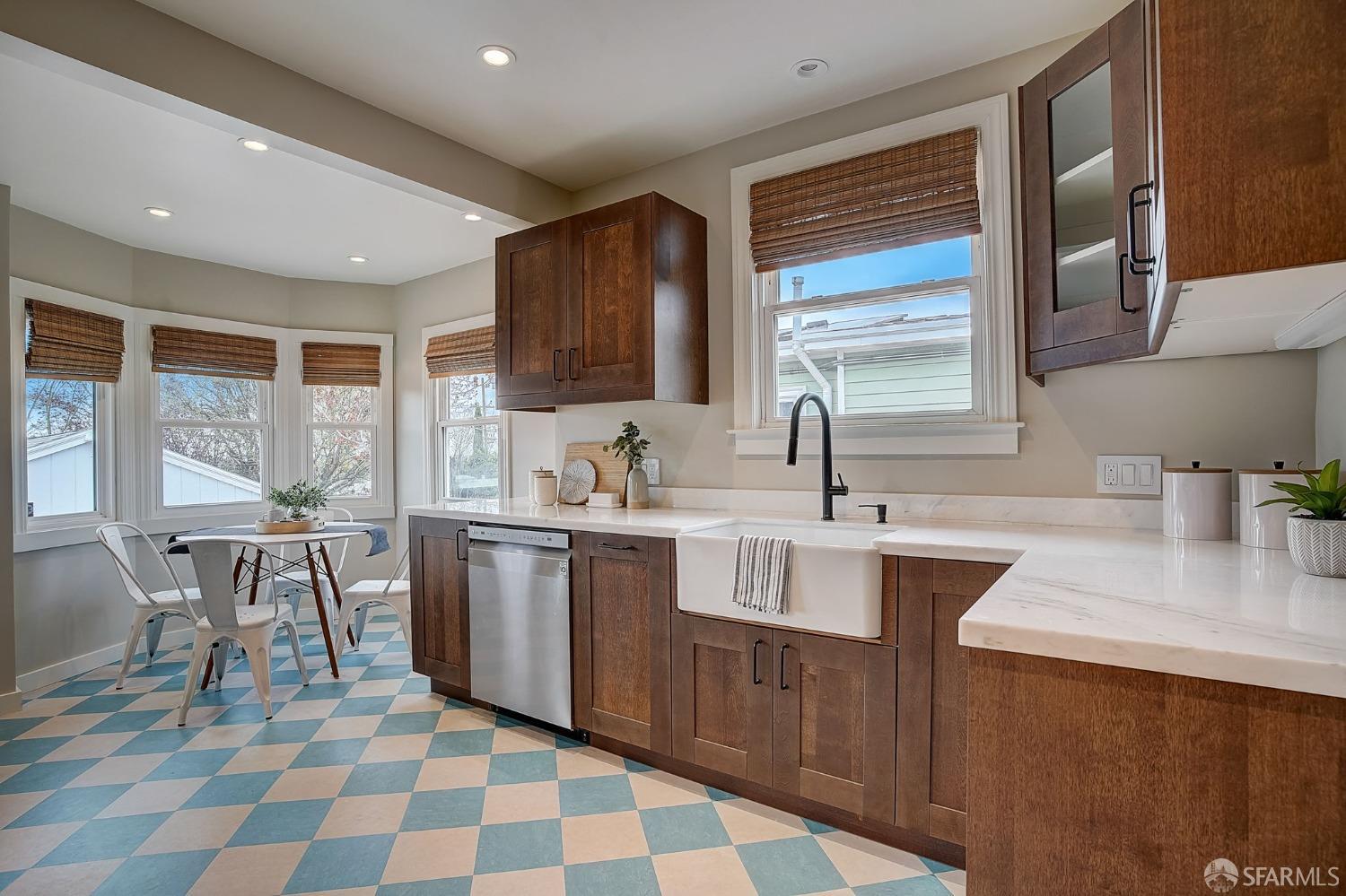 3014 Morcom Avenue Oakland, CA 94619 - Photo 11 of 36 a kitchen with a sink stove and cabinets