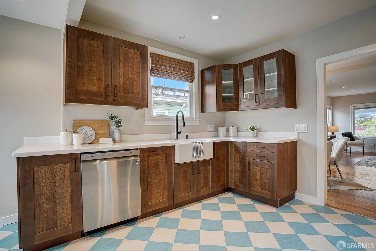 3014 Morcom Avenue Oakland, CA 94619 - Photo 14 of 36 a kitchen with a sink a stove a mirror and cabinets