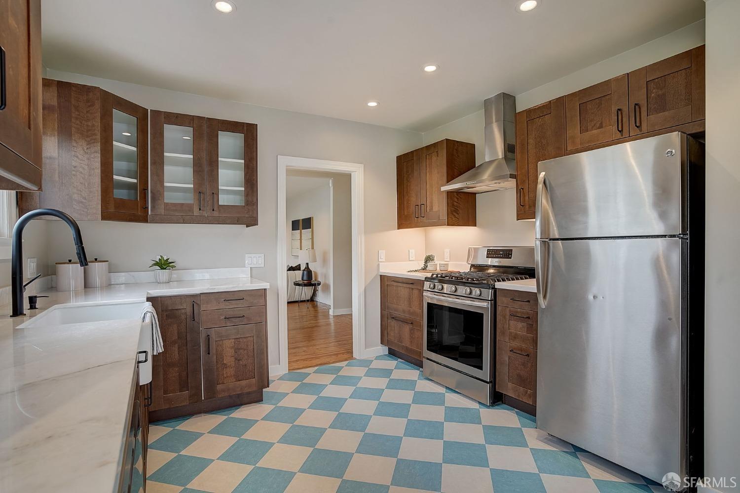 3014 Morcom Avenue Oakland, CA 94619 - Photo 15 of 36 a kitchen with stainless steel appliances granite countertop a refrigerator sink and stove