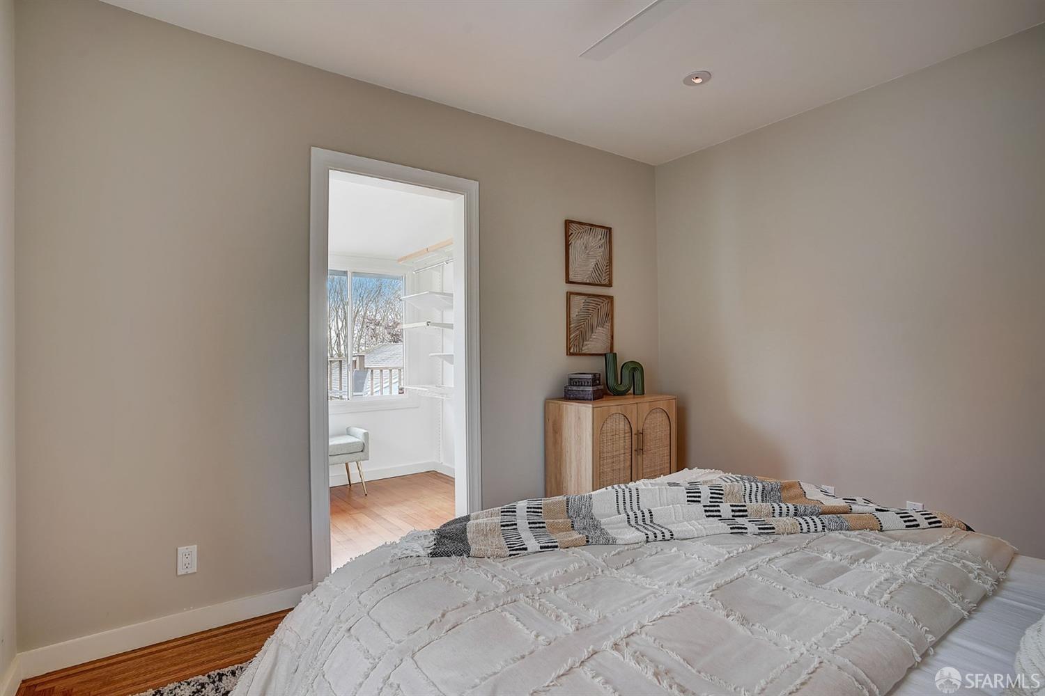 3014 Morcom Avenue Oakland, CA 94619 - Photo 21 of 36 a bedroom with a bed and a lamp on the dresser