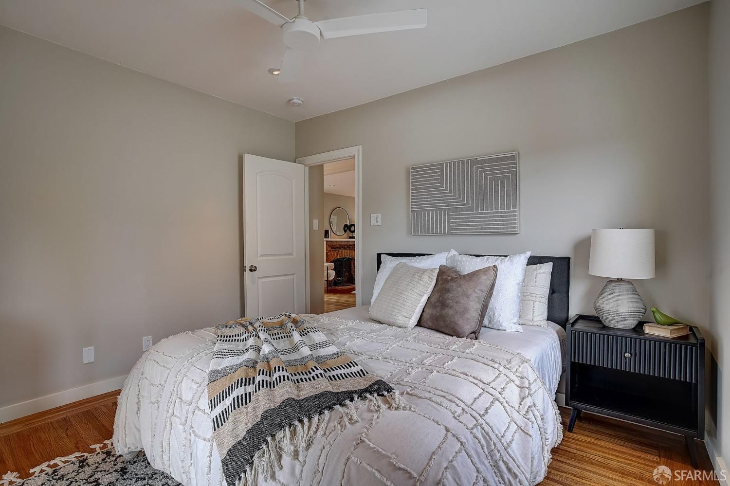 3014 Morcom Avenue Oakland, CA 94619 - Photo 22 of 36 a bedroom with a bed and a lamp