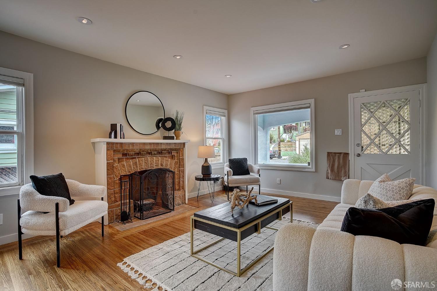 3014 Morcom Avenue Oakland, CA 94619 - Photo 6 of 36 a living room with furniture a rug and a fireplace