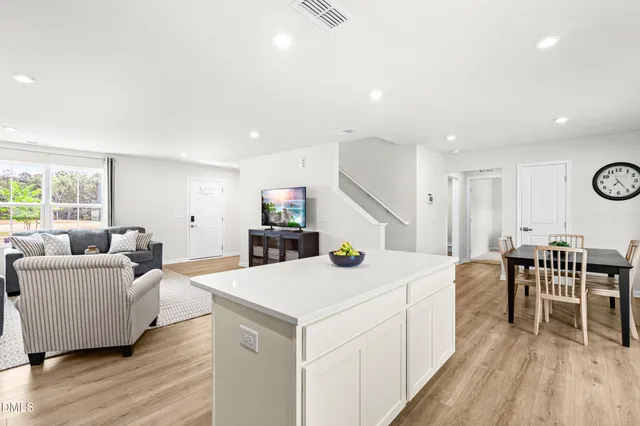 a kitchen with a sink a stove top oven and white kitchen