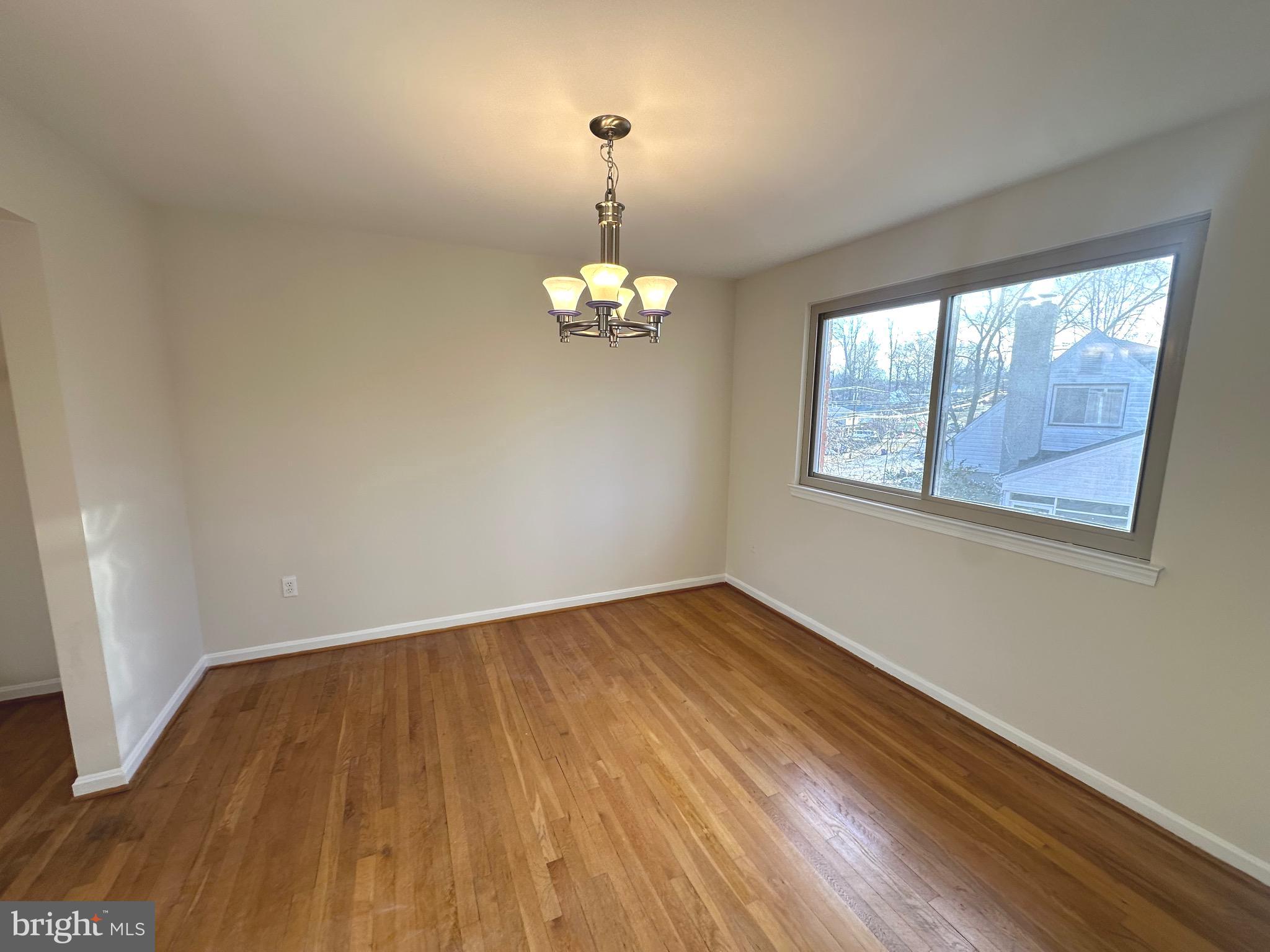 8601 Kenilworth Drive Springfield, VA 22151 - Photo 13 of 47 a view of empty room with wooden floor and fan