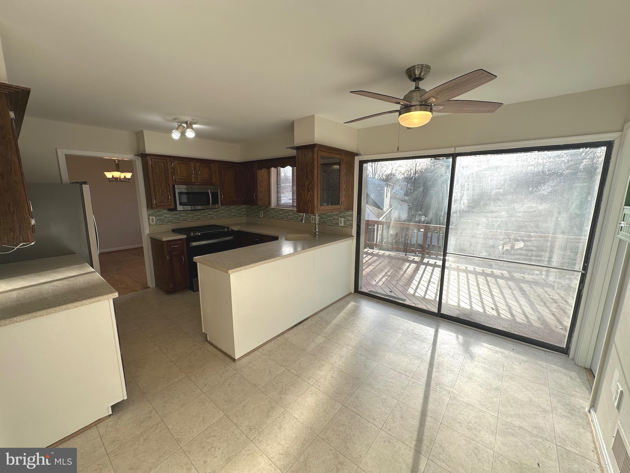 8601 Kenilworth Drive Springfield, VA 22151 - Photo 16 of 47 a view of a kitchen with microwave and stove