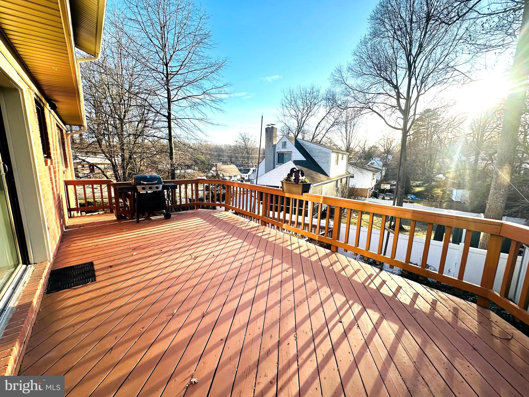 8601 Kenilworth Drive Springfield, VA 22151 - Photo 19 of 47 a view of a roof deck with wooden floor and fence
