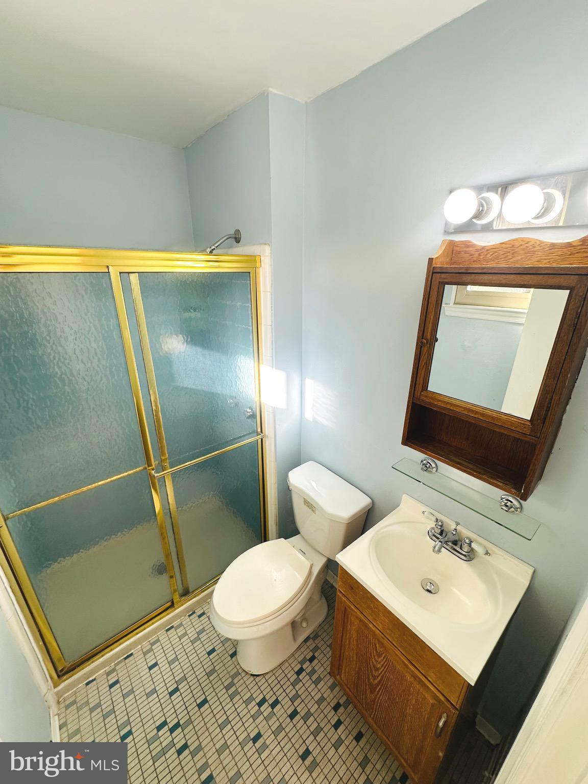 8601 Kenilworth Drive Springfield, VA 22151 - Photo 24 of 47 a bathroom with a sink mirror vanity and toilet