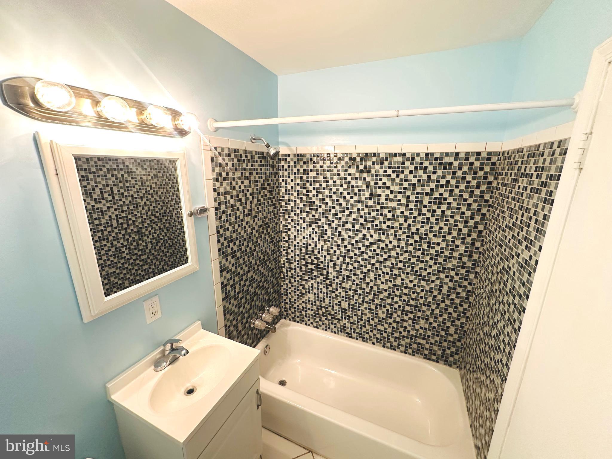 8601 Kenilworth Drive Springfield, VA 22151 - Photo 27 of 47 a bathroom with a sink toilet and shower