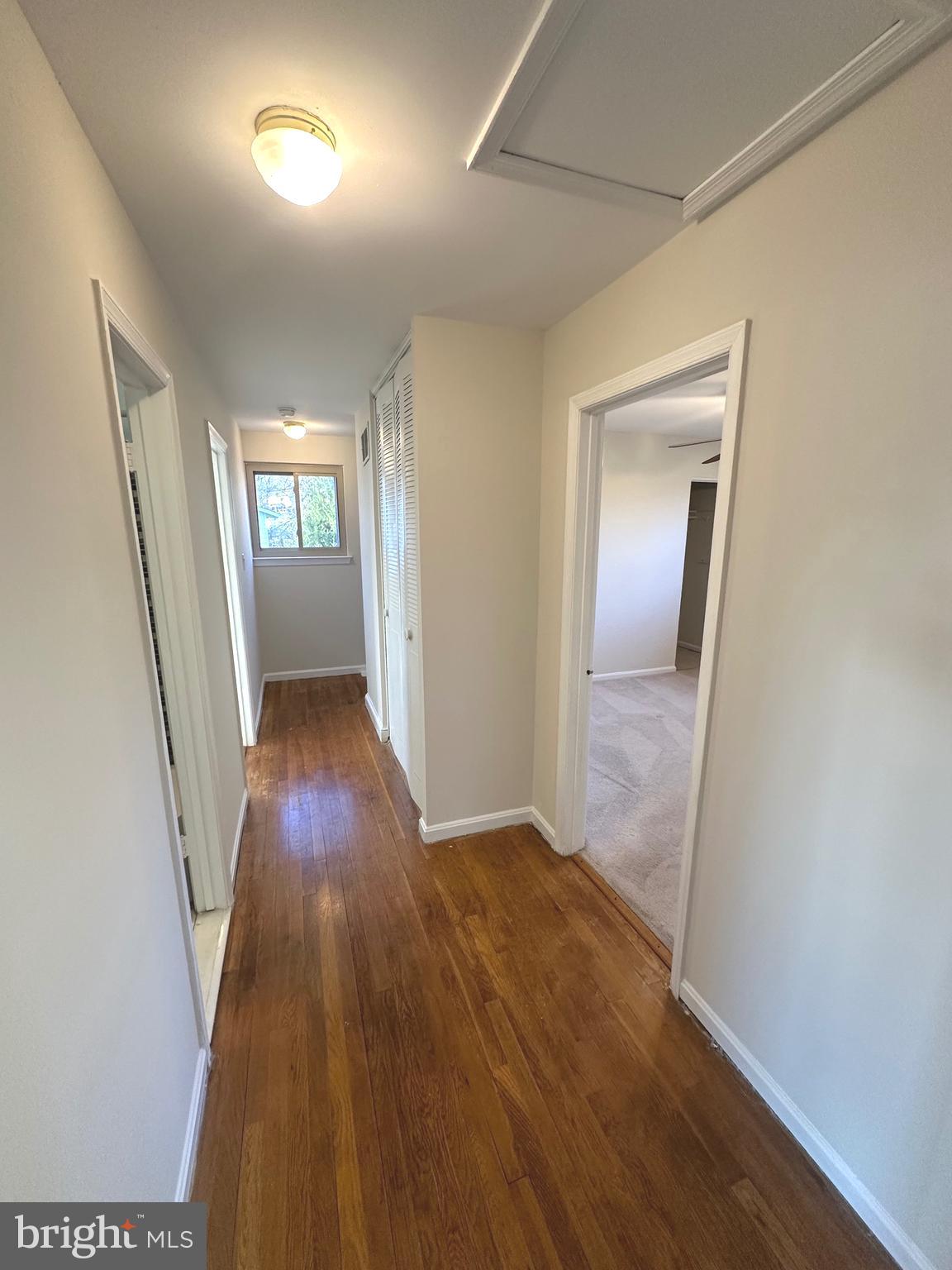 8601 Kenilworth Drive Springfield, VA 22151 - Photo 30 of 47 an empty room with wooden floor and windows